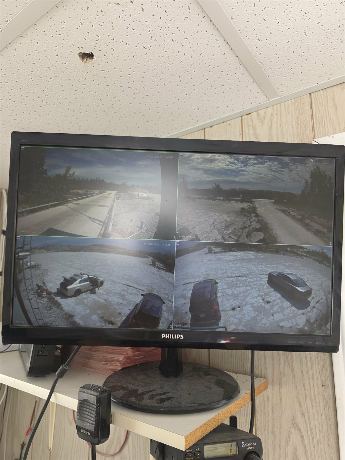 4-camera security monitor showing live surveillance feeds